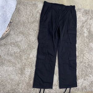Black cargo pants with adjustable length straps